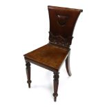 A pair of William IV mahogany hall chairs,