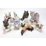 A pair of Staffordshire sponge decorated pottery figures of cats, 9cm wide,