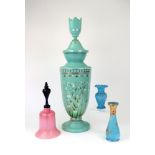 A group of coloured glass, late 19th/20th century, comprising: a tall green glass vase and cover,