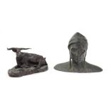 A bronze figure of a buffalo, 20th century, on a shaped naturalistic base,