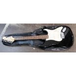 A Squier Strat Fender electric guitar, in black and cream, 33cm wide x 100cm high,