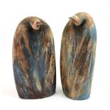A pair of contemporary ceramic sculptures of penguins, with impressed mark 'J B' to base, 38cm high,