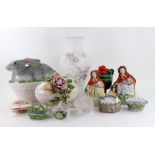 A Saxe porcelain egg shape box, the pull-off cover applied with roses, 21cm wide,