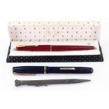 A vintage Watermans black and gilt fountain pen, a boxed Parker '17' crimson and gilt fountain pen,