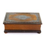 A rosewood rectangular musical cigarette box, early 20th century, with ripple moulded borders,