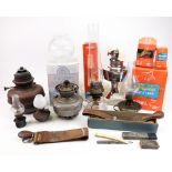 A collection of vintage parafin lamps and chimneys, Poole pottery calypso lamp,