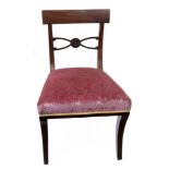 A set of four Regency mahogany dining chairs,