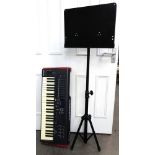 A Novation Impulse 49 electronic keyboard, 84cm wide, together with a music stand (2).