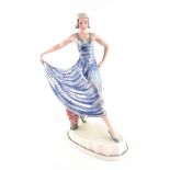 A Goldscheider hand decorated pottery figure of a fashionable young lady, circa 1930,