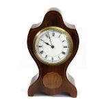 Harrods Ltd: an Edwardian mahogany boxwood strung mantel timepiece, of shaped outline,