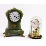 An early 20th century French green onyx gilt metal mounted mantel timepiece,