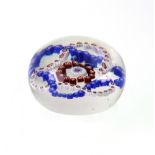 A millefiori glass paperweight, probably French, late 19th / early 20th century, 8cm diameter.