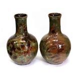 Two Doulton Lambeth Autumn Leaves pattern baluster vases, 27cm high.