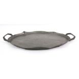 A Tudric oval pewter basket, with foliate pierced and decorated sides and fixed overhead handle,