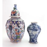 A Dutch Delft 'Cashmire' palette vase and cover, 19th century, of ribbed ovoid form,