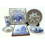 A Dutch Delft blue and white tile panel, 20th century, painted with a sailing vessel, 39 x 26cm,