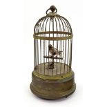 A French gilt metal singing bird cage bird automaton music box, early 20th century, 32cm high.