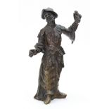 A bronze cast as a standing asian figure, European, 19th century, one arm raised aloft, 18.5cm high.