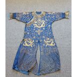 A Chinese blue gauze summer robe, worked with gilt dragons amongst cloud scrolls, (a.