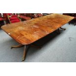 A Regency style mahogany twin pillar extending dining table, on eight downswept supports,