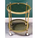 A mid-20th century lacquered brass circular two tier trolley,