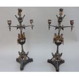 A pair of patinated bronze three branch candelabra, late 19th century,