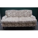 Wesley Barrell; a 20th century twin tone floral upholstered double hump back sofa,