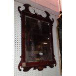 An early 19th century mahogany fret cut pier glass, 71cm wide and another similar smaller,