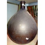 A 20th century amber coloured distillery vase, of tapering form, 65cm high.