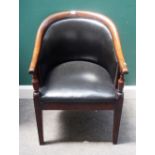 An early 19th century style tub back office chair, with studded green leather upholstery,