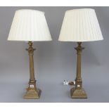 A pair of Victorian style brass table lamps, each of Corinthian column form,