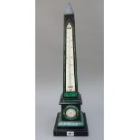 A Victorian black marble and malachite inlaid thermometer/barometer, of obelisk form, 58cm high.