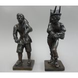 A pair of French bronze figures, late 19th century, modelled and cast as faggot gatherers,