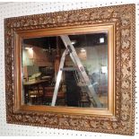 A 20th century gilt framed rectangular mirror, with moulded acanthus frame, 72cm wide x 64cm high.