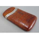 A crocodile skin cigar case with silver mounts, hallmarked London 1909, 13cm long,