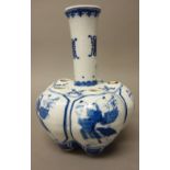 A Chinese blue and white crocus vase, 20th century, the lobed body painted with panels of boys,