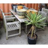 A 20th century rectangular teak garden table and four chairs, 160cm wide (5).