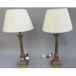 A pair of Victorian style brass table lamps, each of Corinthian column form,