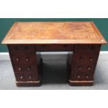 A Victorian mahogany writing desk, with nine drawers about the knee, on plinth base,