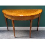 A George III style satinwood semi-elliptic console table, on tapering square supports,