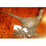 A 20th century carved wooden wall plaque of a pheasant.