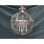 A modern silvered metal lantern, of globular sectional form,