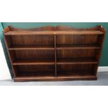 An early 20th century oak floor standing twin section open bookcase,