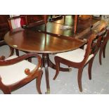 A Regency style mahogany twin pillar 'D' end extending dining table, with two extra leaves,