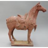 A Victorian cast iron model of a horse, later painted in a red wash, on a rectangular plinth, 40.