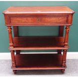 An early 19th century French mahogany three tier buffet, with single drawer on fluted supports,