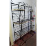 A 20th century brass and black painted wrought iron four tier baker's rack,