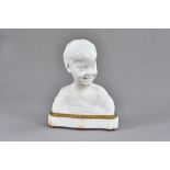 An Italian marble bust of a young smiling boy, unsigned, on a gilt bronze mounted,