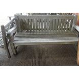 A similar pair of teak slatted garden benches, 185cm wide, (2).