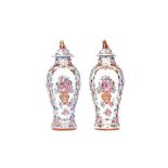 A pair of Chinese famille-rose baluster vases and covers, Qianlong,